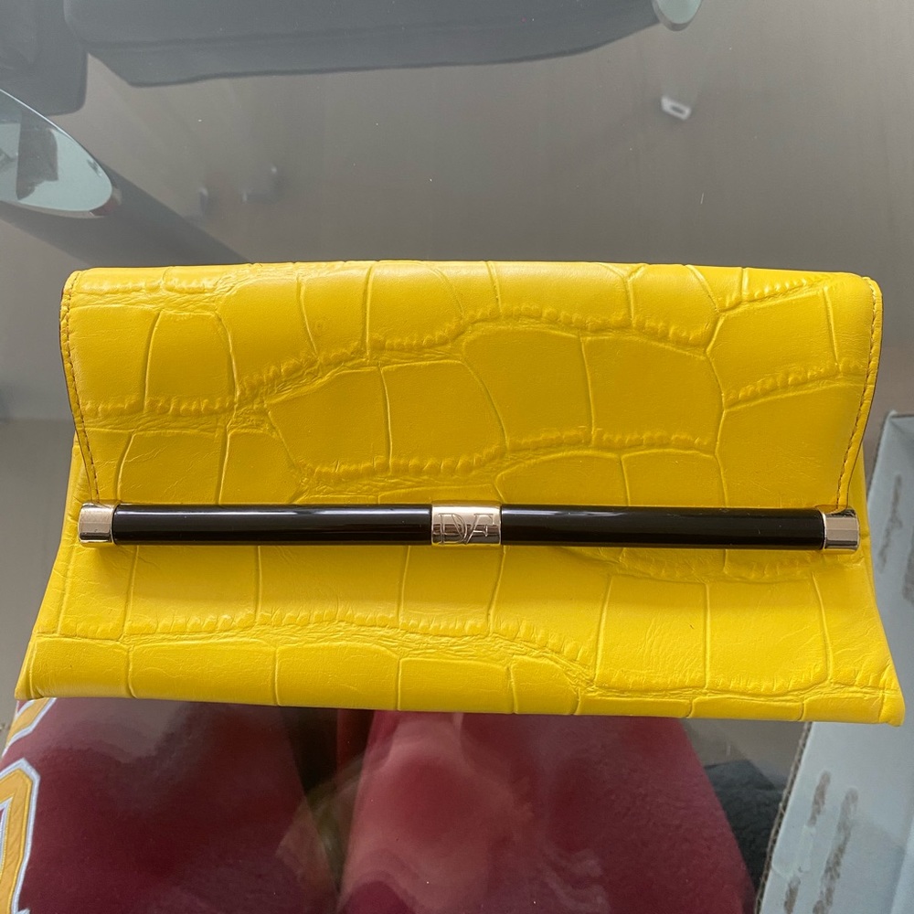 DVF clutch with tags